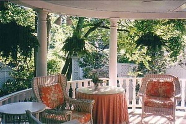 Beautiful city home with porches overlooking award-winning gardens.