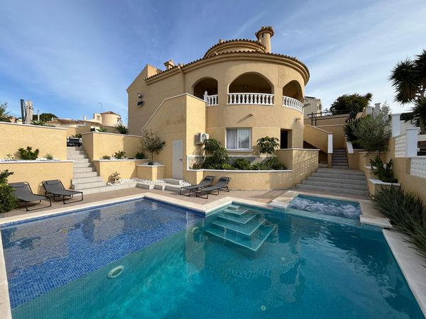 Beautiful  5-bedroom villa with private pool and jacuzzi, surrounded by a lush garden with multiple terraces.