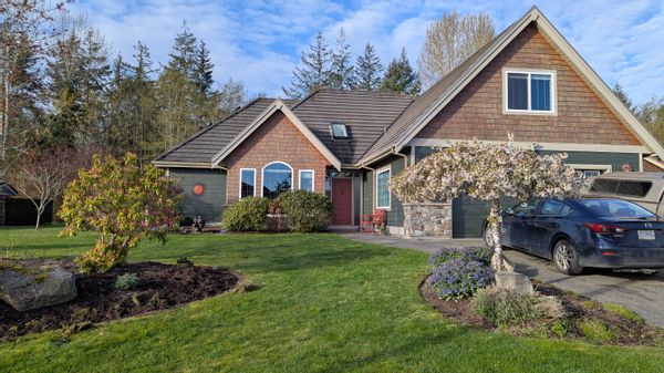 Well appointed, large craftsman style home on one level with lovely gardens, quiet cul-de-sac.