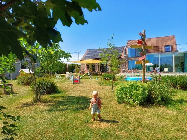 A charming (children's) farm with a big playground, animals and a gipsy wagon