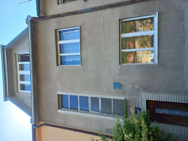 1939 town house on a hill overlooking Prague from above forest