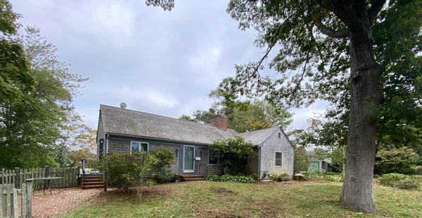 Stunning views at this charming and magical lakeside Cape Cod cottage!