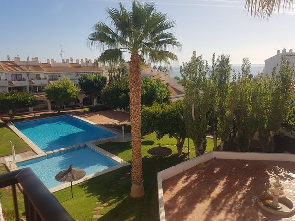 Perfectly located apartment in beautiful gardens, large pool, steps from the sea, stroll to centre of Campello