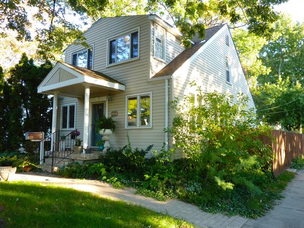 Spacious upper bedroom with queen bed and fireplace for extra heat in winter months. Access to kitchen and washer and dryer in basement. Parking in driveway or in the street.