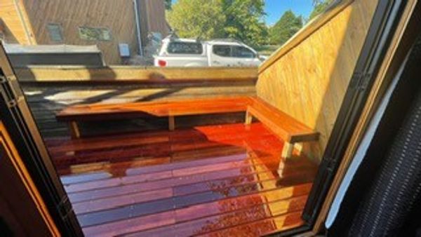 A classic ski chalet with a fire place and a hot tub.