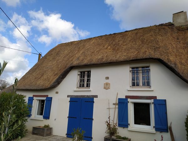 Thatched cottage at FEREL (South Morbihan), in Brittany in West France near Atlantic Ocean