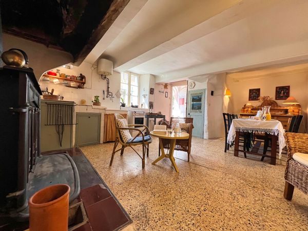 Very nice ancient house at the top of the village with a very nice view on the roofs of the village and on the green landscape, on both sides. A terrace-garden of 50 M2 just in front of the house, ideal for eating, sunbathing, reading.