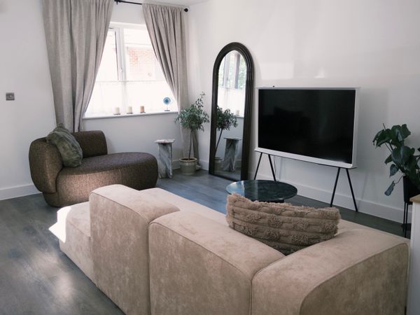 En-suite bedroom in a three-bed house with a garden