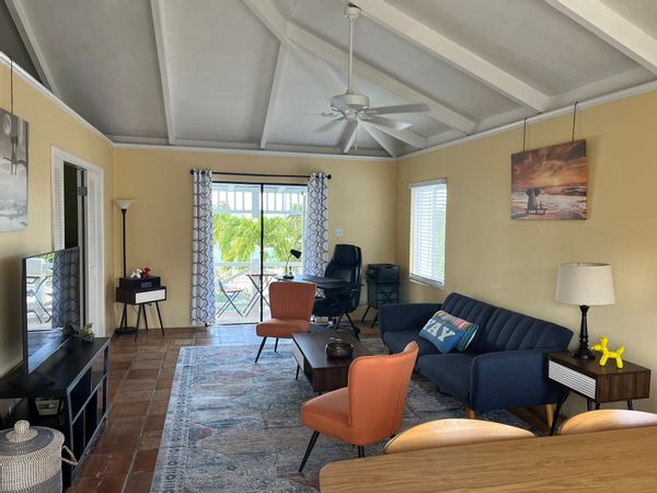 Quaint, breezy tropical villa in gated community with ideal location