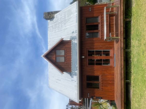 New Zealand two houses one on Great Barrier Island and one in Auckland rustic house modern house.
