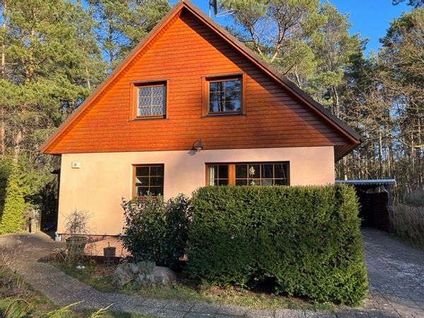 Home in the forest but with a train station, from where is possible to get to Berlin in an hour:)