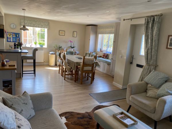A modern 4 bedroom house situated near St Leonards Church in the picturesque village of Bledington in the heart of the Cotswolds. A thriving village with many beautiful walks close by including The Oxford Way.  The village has an award winning public house, The Kings Head Inn and a community run shop and cafe with fresh local produce.   it is 1 mile from Kingham station with direct access to London Paddington (from 76 minutes) – (Heathrow Express) and central London 40 minutes from the M5  North – South and M4 to Wales  and 40 minutes to the M40 – London     Brecon Beacons, Soho Farmhouse (20mins)  and Daylesford Organic Shop and Spa  (5mins) Other local attractions nearby include Stow-on-the-Wold, Chipping Norton, Bibury, Cheltenham,  Cotswold Farm Park, Longborough Opera,  Diddly Squat Farm Shop, Cotswold Water Park and everything else on offer in the heart of the Cotswolds.  There