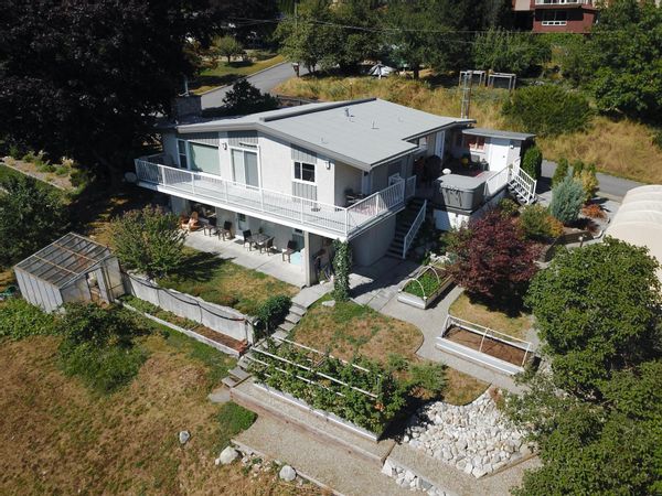 Charming mid-century modern home with beautiful updates, an incredible lake view, and within close proximity to Nelson's charming townsite