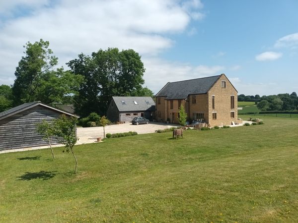 Mark's house is on a 70 acre farm with cattle grazing at the front of the house via the panoramic countryside views