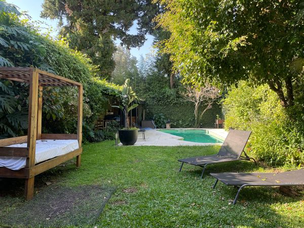 Room in large family home in quiet San Isidro, near the river, cafés and transport.
