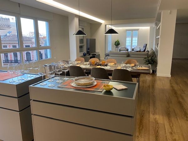 Stunning Sun-Filled Apartment in Valencia's City Center with wrap-around balcony.  Experience the vibrant heart of Valencia in this spacious, bright apartment that perfectly combines luxury and convenience. Located on the 5th floor, this beautiful residence features three generously sized bedrooms, plus dedicated office and three modern bathrooms, ensuring ample space for relaxation and privacy. Enjoy a touch of exclusivity with private elevator access that leads directly into the apartment and a full time doorman.  The sun-drenched living areas are designed to create an inviting atmosphere, enhanced by large windows that fill the space with natural light. Step onto the balcony to soak in the city views while savoring your morning coffee or unwind in the evening and watch the sunset over the city center. Stay connected with high-speed WiFi and enjoy your favorite shows on the smart 75 "
