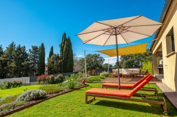 Sunny modern house in front of the mountains