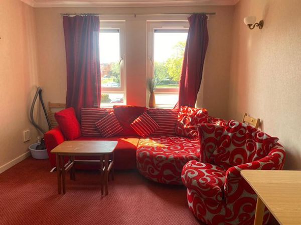 A beautiful and spacious bedroom with views onto open green . Very good connections to the city