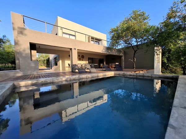 Modern house with pool surrounded by Kruger Park wildlife. 3 bedrooms, 3 bathrooms