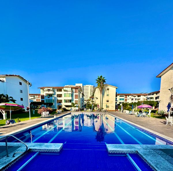 Walk to Beach • Pool • AC • 2BR Condo • Prime location, Shops & Restaurants