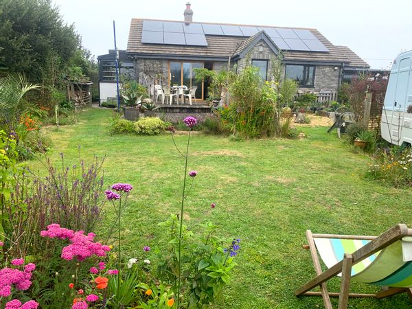 Walking distance to beaches, quiet, detached, light, bungalow with great views surrounded by garden.