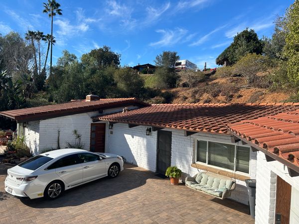 Scott and Kristin’s mid-century modern adobe brick home.