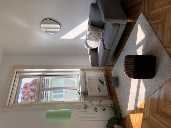 Hugo's house is furnished with minimalist design pieces, giving it a cozy, warm flair.