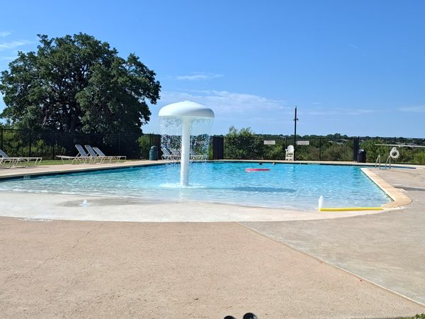 Spacious family friendly home with nature trails, a community pool, and entertainment district!