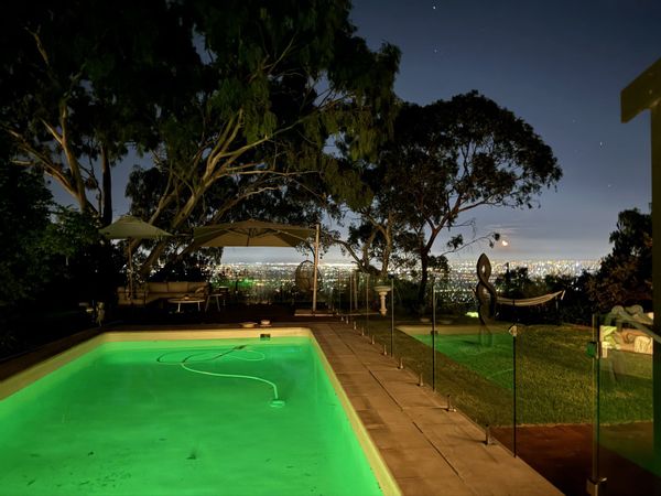 House with pool, ocean and city views