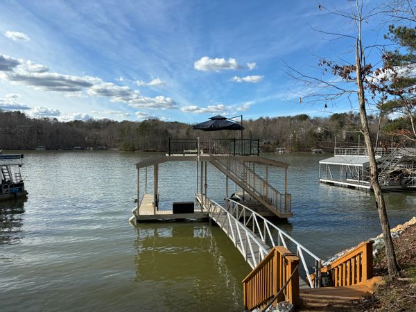 Sunset House on Lake Lanier.  Enjoy time with family & fish, boat, or relax on our 2-story dock.