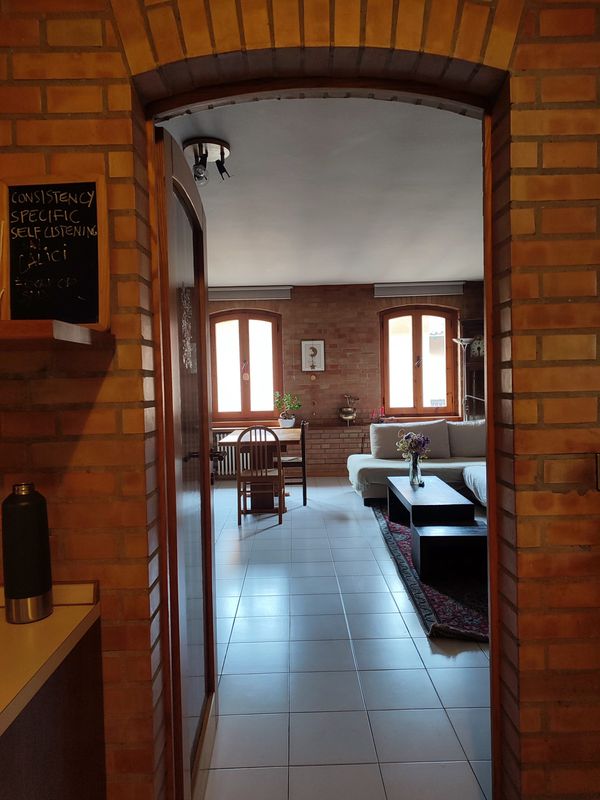 The red brick house surrounded by fields, mountains, a crystal-clear river and a lake 5 km away.