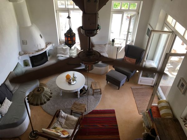 Gorgeous small house in a garden on a hill at the edge of a traditional village overlooking the sea.