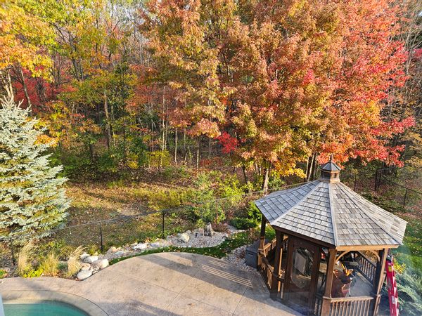 Beautiful home in heart of Ottawa suburbs with private pool, hot tub, and nature trails.