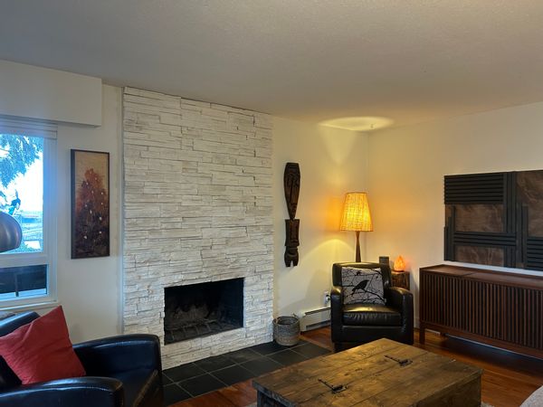 Cozy top floor 1 bedroom condo with wood burning fireplace and sunset views.