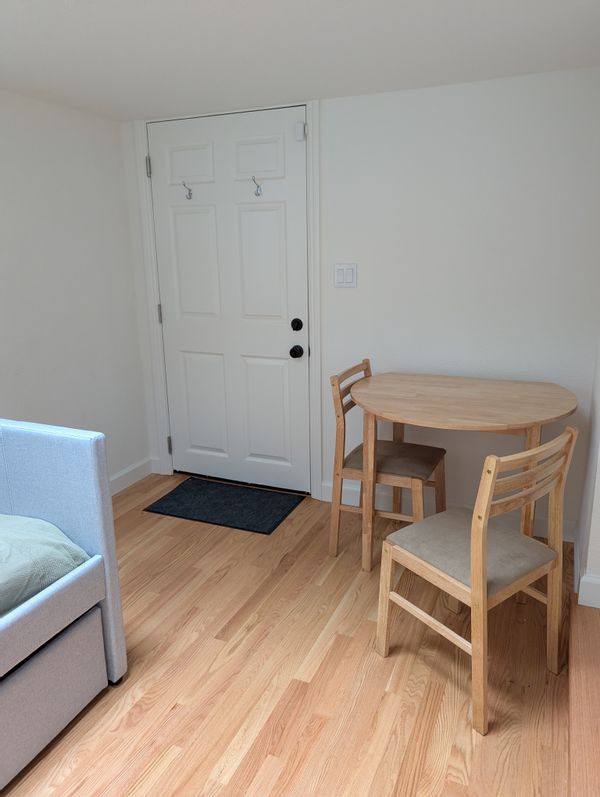 Private furnished studio with separate entrance and access to a shared outdoor patio and garden.