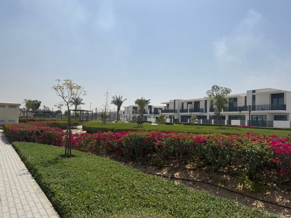 Gated Community Dubai. Three-bedroom house + maid’s room, family-friendly, pool, playgrounds, park.