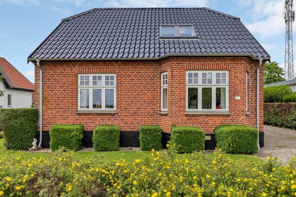 Traditional Danish red brick villa close and connected to Aarhus