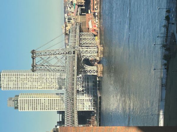 Kevin & Jack's apartment is on a high floor with a balcony, overlooking the East River and Brooklyn.