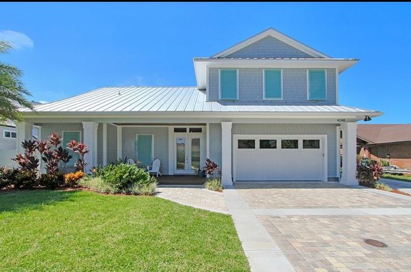 Jacksonville Beach coastal home with pool & boat dock