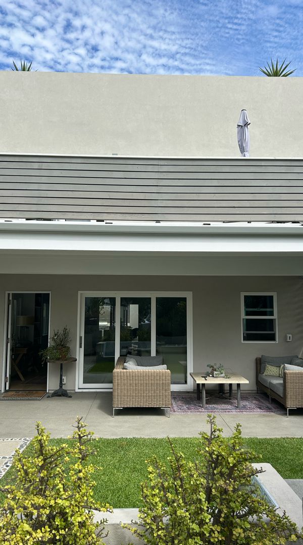 Bruce's house is a 2 story home with a large roof deck with  views, decks with BBQ, fridge, etc.