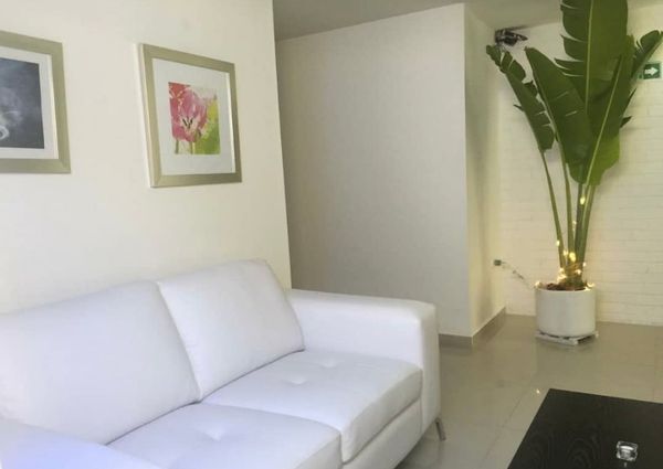 Mariluz's private room is cozy, big, has central AC and private bathroom.