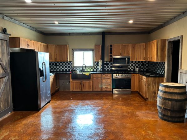 Custom shop house. Rustic decor.  irrigated pasture. Total of 9 acres. Great views of mountains