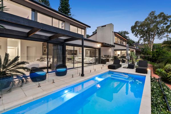 Rare, level waterfront setting; stunning designer retreat