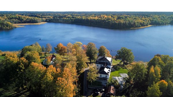 Lake house on private manor estate in Swedish countryside, private dock and row boat.