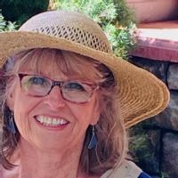 Cabin at a creek in the woods.