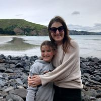 Vintage house-bus in a park-like backyard.