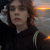 A spacious, cozy studio with artistic details, a large TV, and a private entrance to the backyard.