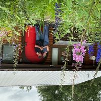 Collette and Nicks log cabin is a charming, cozy, rustic home with view and access to a lake.